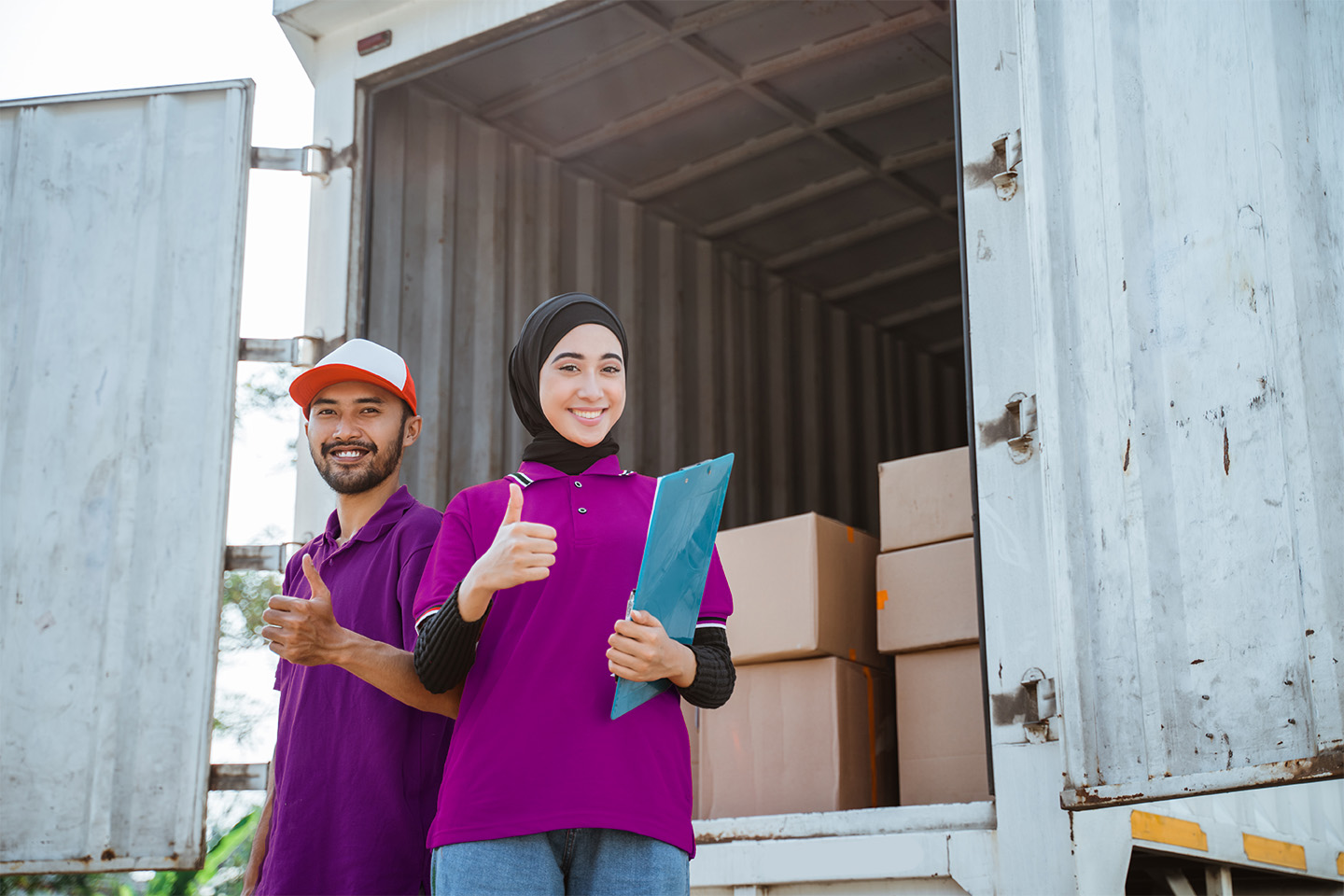 female-worker-wearing-hijab-delivery-man-wearing-red-uniform-with-thumbs-up-logis